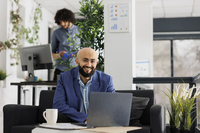 Side view of businesswoman working at office