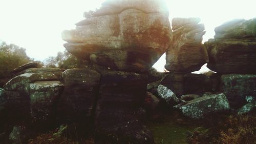 Close-up of rock formation against sky