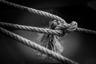 Close-up of rope tied up on metal