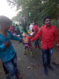 Rear view of people enjoying in park