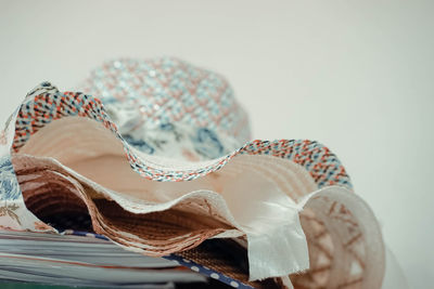 Close-up of shells on table against white background