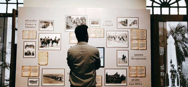 Rear view of woman in museum