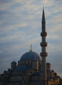 Low angle view of mosque against sky