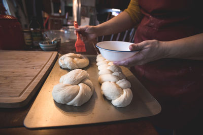 Midsection of man preparing food on table