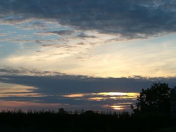 Scenic view of silhouette trees against sky during sunset