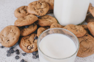Close-up of cookies and milk glass