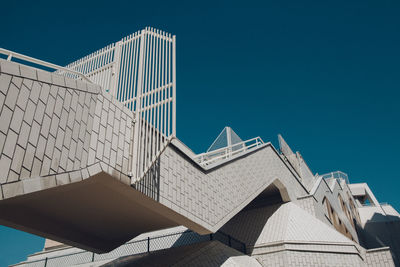 Low angle view of building against clear blue sky