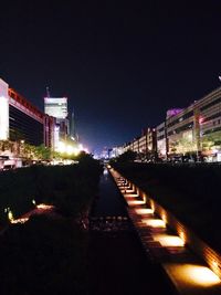 Illuminated bridge at night