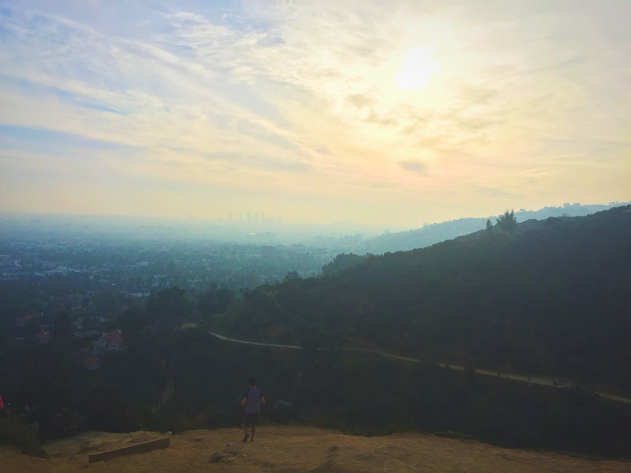 sky, lifestyles, sunset, leisure activity, men, landscape, scenics, walking, sun, beauty in nature, nature, silhouette, sunlight, cloud - sky, person, tranquility, tranquil scene, standing, full length