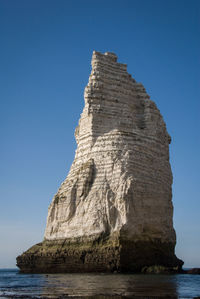 Main rock of etretat view from bellow on ground level