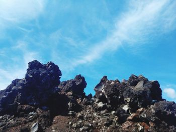 Low angle view of rock formation against sky