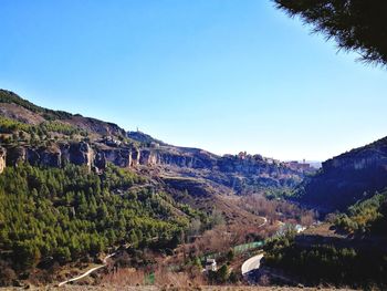 Scenic view of mountains against clear blue sky