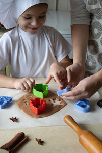 Midsection of man working on table