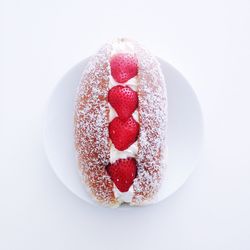 Close-up of strawberry cake on white background