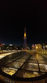 Illuminated buildings in city at night