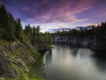 Scenic view of lake against sky at sunset