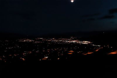 Illuminated cityscape at night