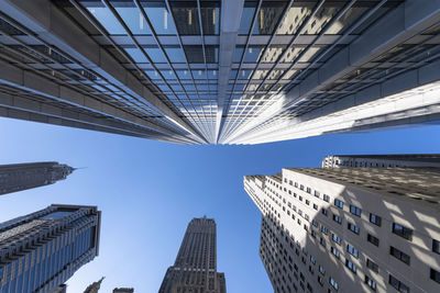 Low angle view of modern buildings against clear sky