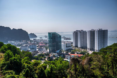 High angle view of trees and buildings against sky