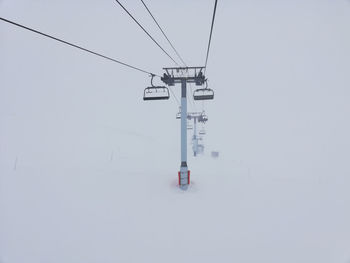 Ski lift going into the misty mountain