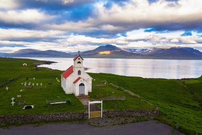 Panoramic view of building and mountains against sky