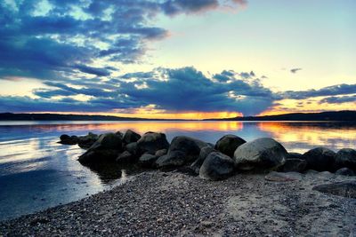 Scenic view of sea against sky at sunset