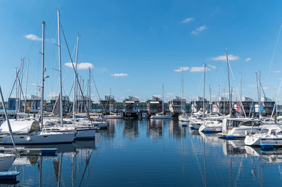 Boats moored at harbor