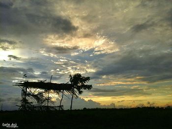 Silhouette tree against dramatic sky