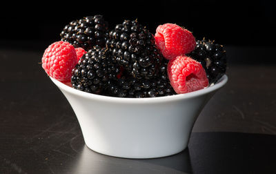 Close-up of strawberries in bowl on table