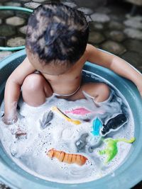 High angle view of boy playing with water