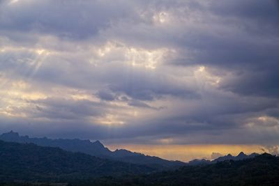 Scenic view of mountains against dramatic sky