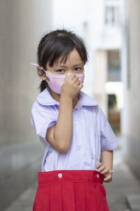 Portrait of girl wearing mask