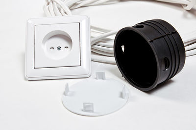 Close-up of electrical equipment against white background