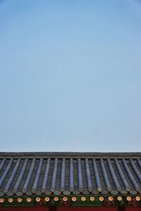 Low angle view of built structure against clear blue sky