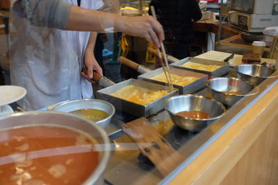 Group of people working in kitchen