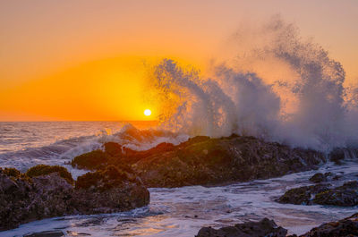 Scenic view of sea against sky during sunset