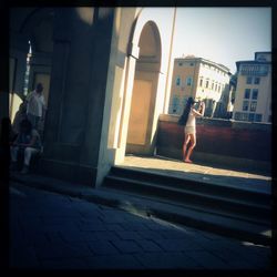 Woman walking on city street