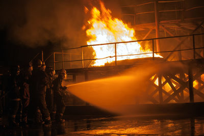 Panoramic shot of bonfire against sky at night