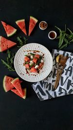 High angle view of fruits in plate on table