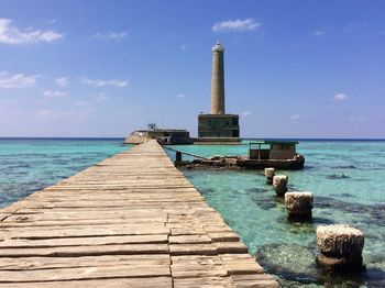 Pier over sea against sky