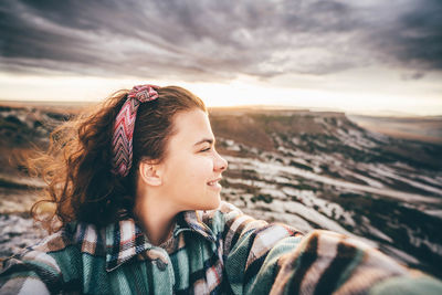 Woman making a selfie in the mountain.