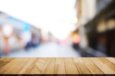 Close-up of wooden table against clear sky