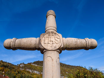 Low angle view of statue against sky