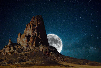 Low angle view of rock formation against sky