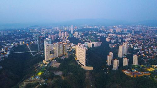 Aerial view of cityscape against sky