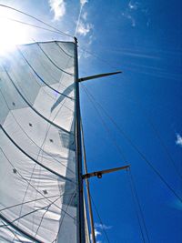 Low angle view of mast against blue sky