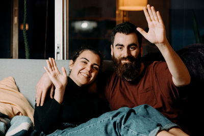 Low angle view of young woman sitting at home