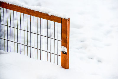 Close-up of gate blocked by snow