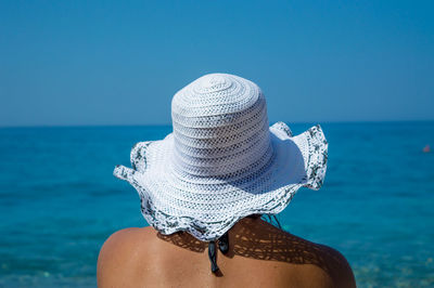 Rear view of woman looking at the ocean