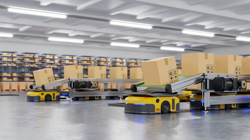 Boxes on conveyor belt in warehouse